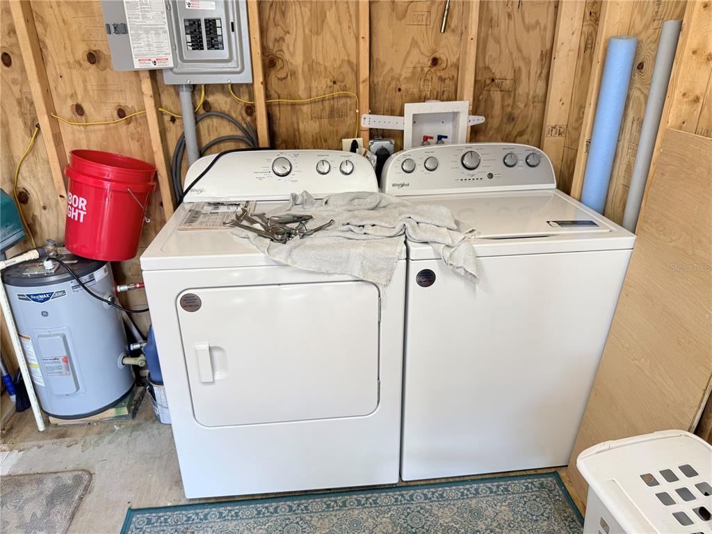 2875 Northeast 102nd Ave Road Silver Springs, FL 34488 - Photo 14 of 68 a utility room with dryer and washer