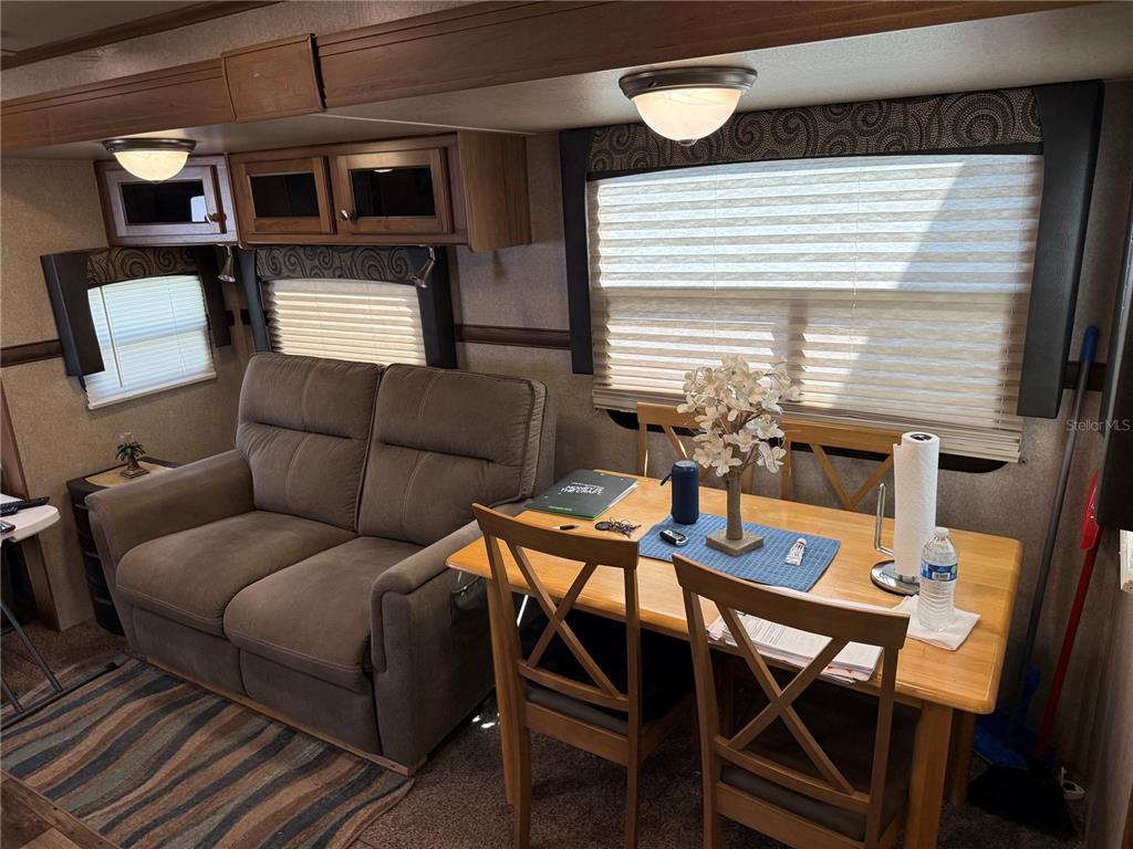 2875 Northeast 102nd Ave Road Silver Springs, FL 34488 - Photo 32 of 68 a view of a livingroom with furniture and window