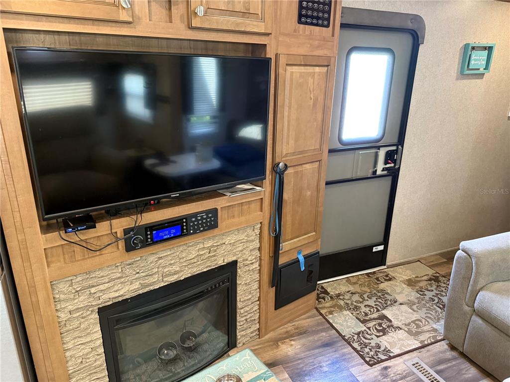 2875 Northeast 102nd Ave Road Silver Springs, FL 34488 - Photo 33 of 68 a living room with furniture and a flat screen tv