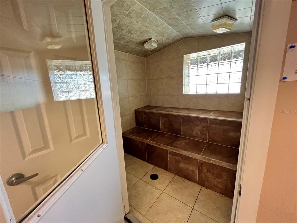 2875 Northeast 102nd Ave Road Silver Springs, FL 34488 - Photo 40 of 68 a view of walk in closet with window