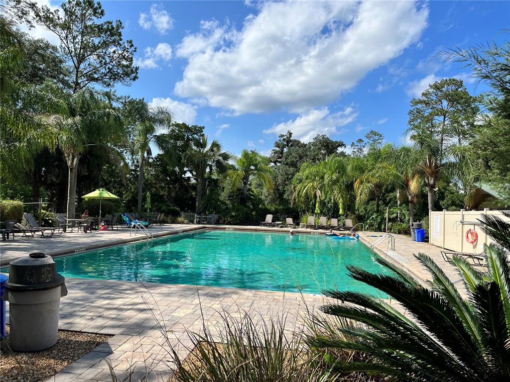 2875 Northeast 102nd Ave Road Silver Springs, FL 34488 - Photo 60 of 68 a view of a backyard with sitting area