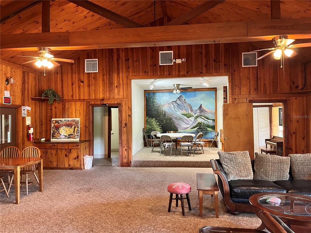 2875 Northeast 102nd Ave Road Silver Springs, FL 34488 - Photo 63 of 68 a living room with furniture and a flat screen tv