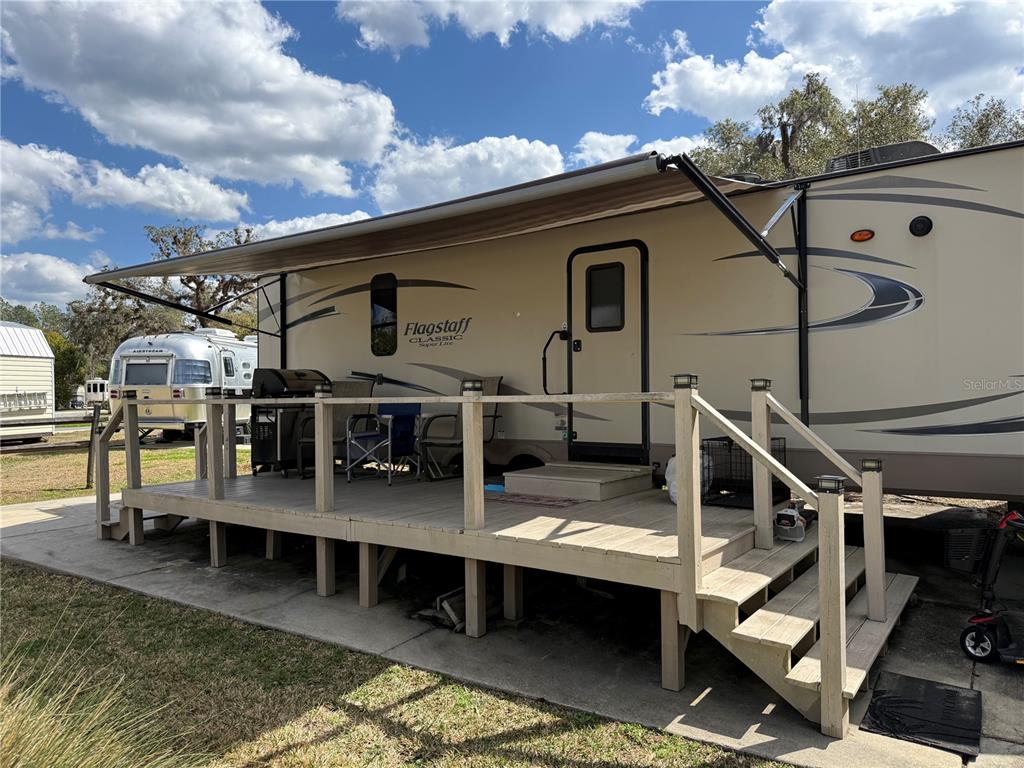 2875 Northeast 102nd Ave Road Silver Springs, FL 34488 - Photo 7 of 68 a view of house with outdoor space