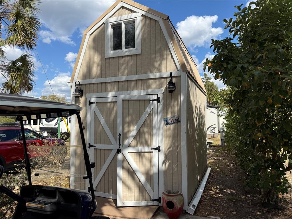2875 Northeast 102nd Ave Road Silver Springs, FL 34488 - Photo 9 of 68 a front view of a house with a yard