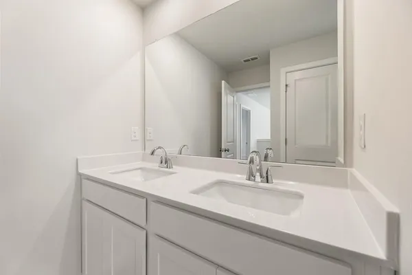 a small space with a shower and vanity