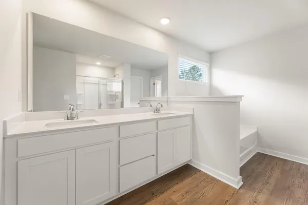 a bathroom with a glass shower door