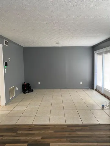 a view of room with wooden floor