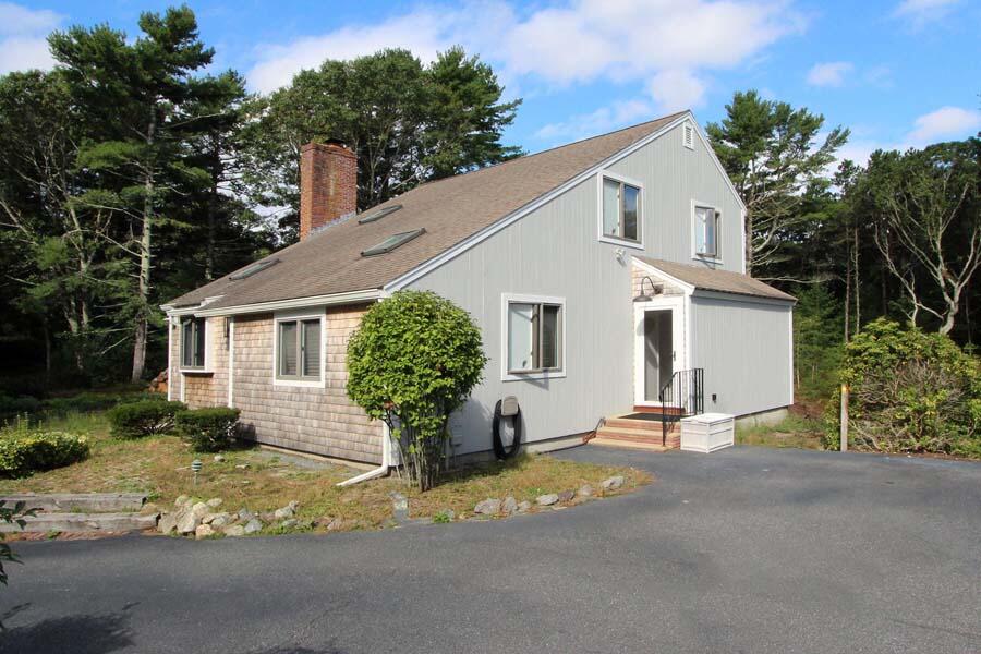 136 West Way Mashpee, MA 02649 - Photo 1 of 30 a view of a house with backyard and sitting area