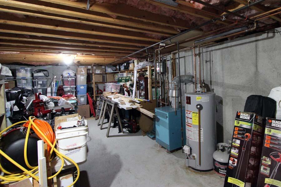 136 West Way Mashpee, MA 02649 - Photo 21 of 30 a view of a storage room with racks