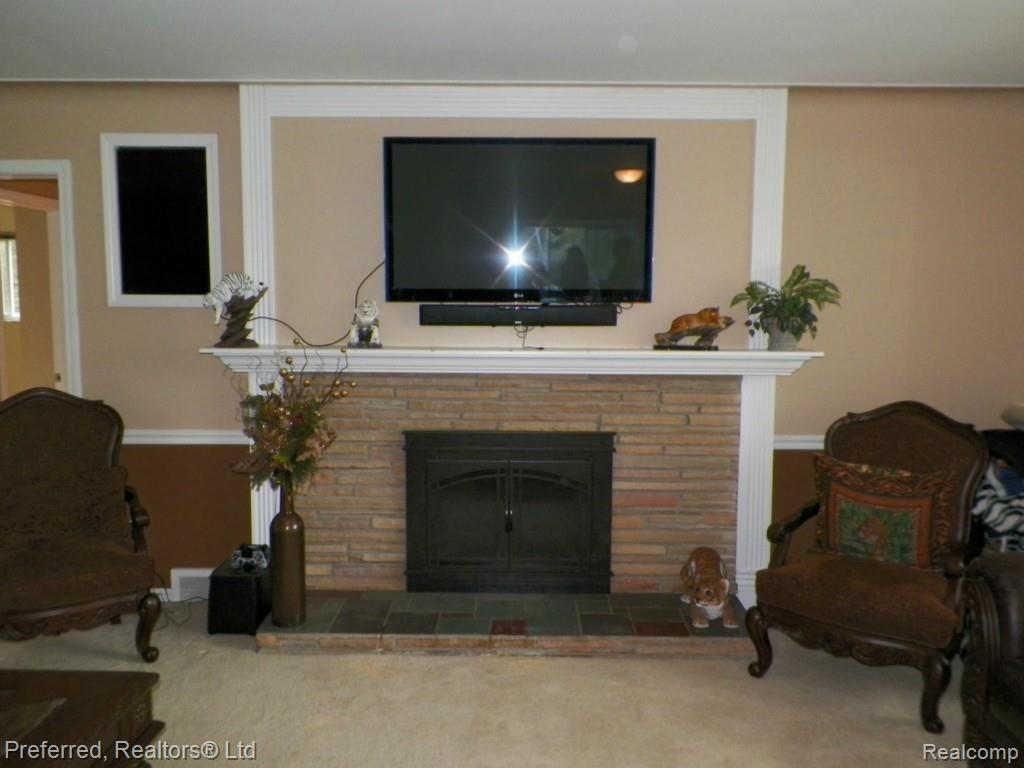 41700 Eleven Mile Road Novi, MI 48375 - Photo 14 of 25 Custom Surround Limestone & slate Natural Fireplace!