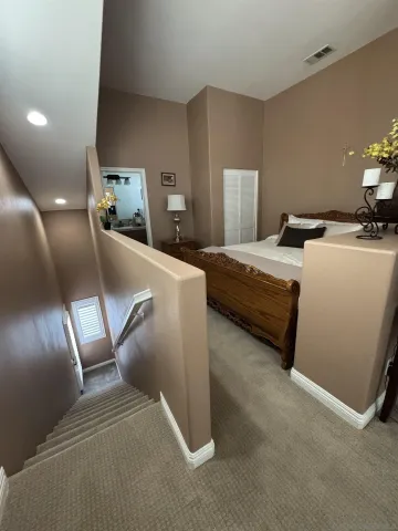 a bedroom with bed and window