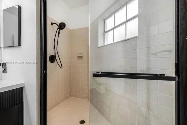 a bathroom with a bathtub and a shower