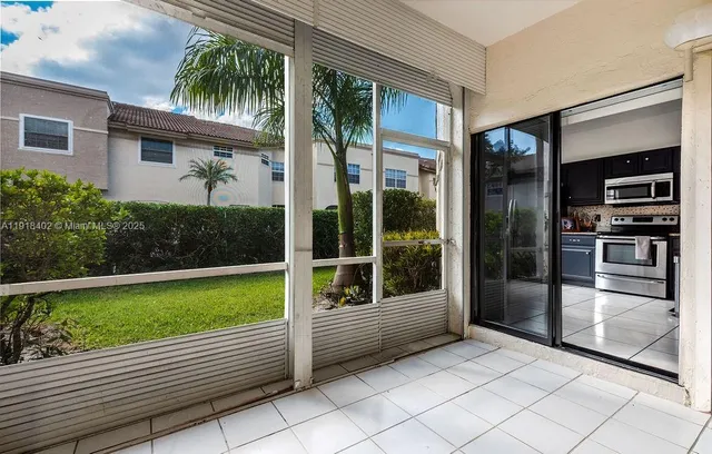 a view of swimming pool with a garden and plants