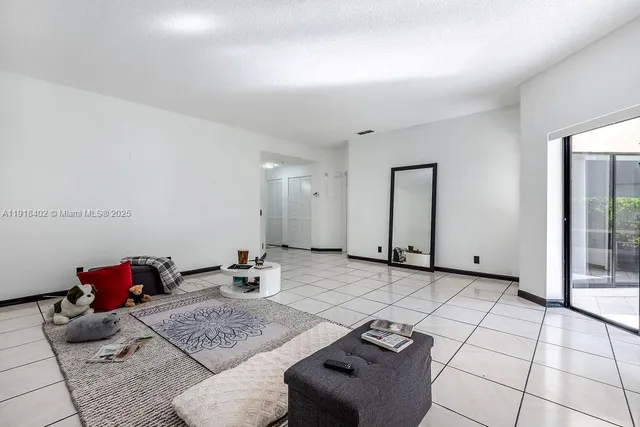 a living room with furniture and a table