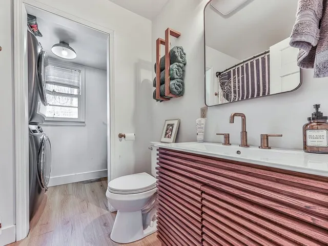 a view of livingroom with washer and dryer
