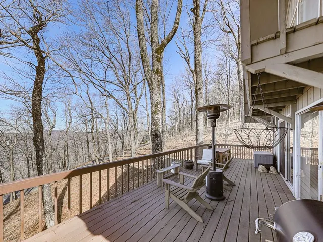 a large tree in front of a house