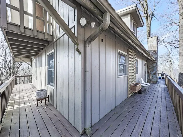 a view of house with a yard