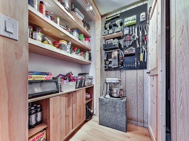 a view of a house with a yard covered in snow