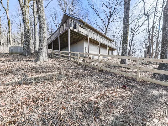 a view of a backyard of the house