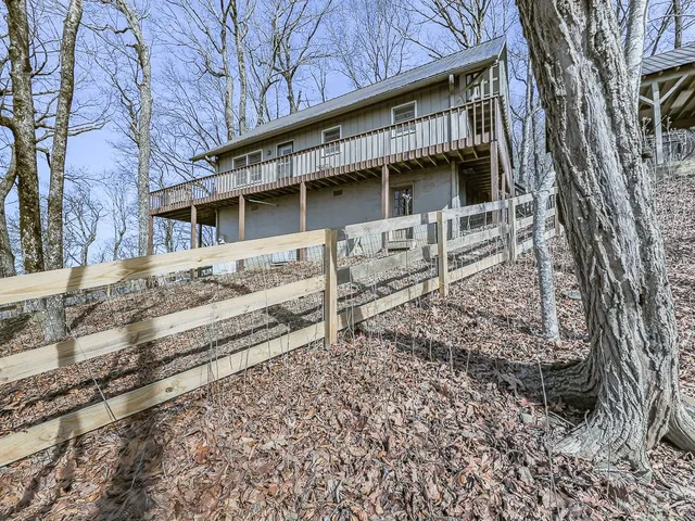 a view of a green field with lots of bushes