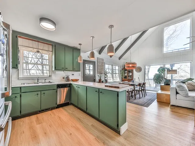 a kitchen with lots of counter top space and dining table