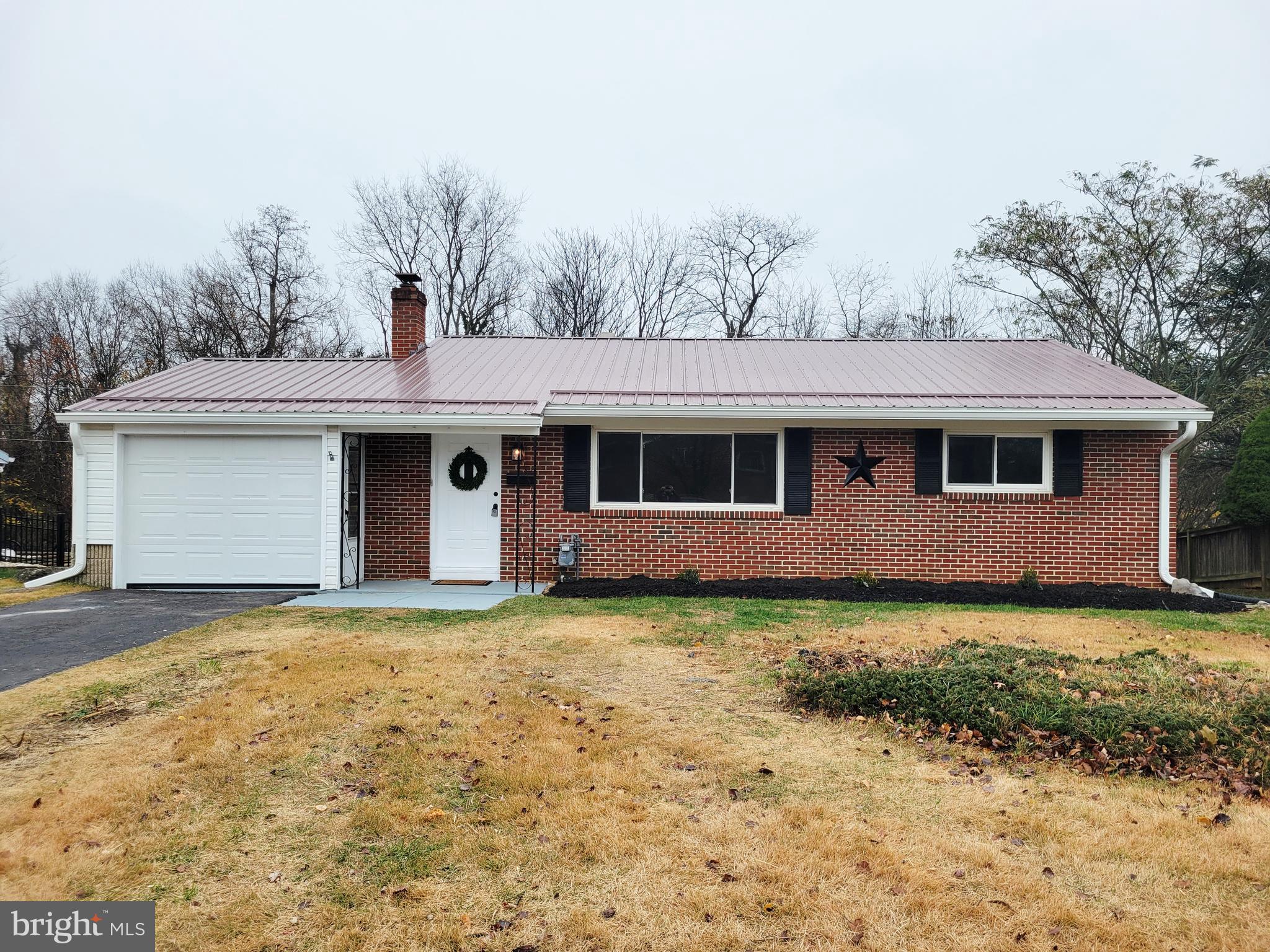 11525 Englewood Road Hagerstown, MD 21740 - Photo 1 of 21 a front view of a house with garden