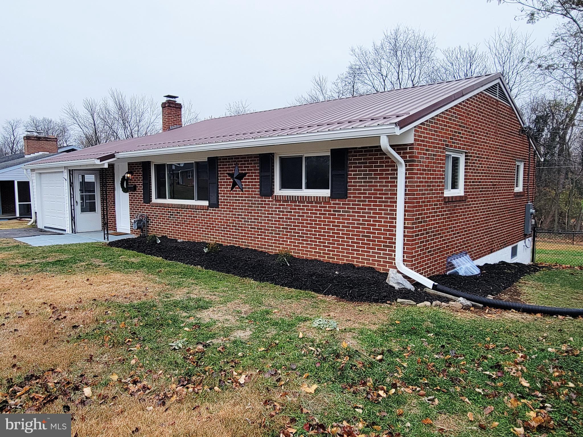 11525 Englewood Road Hagerstown, MD 21740 - Photo 19 of 21 a front view of a house with a yard
