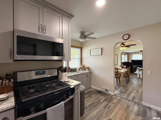 a kitchen with a stove and a microwave