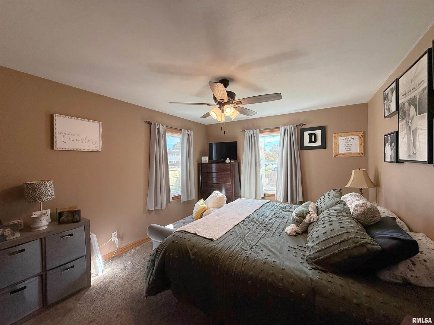 640 32nd Avenue Moline, IL 61265 - Photo 21 of 37 a bedroom with a bed and wooden floor