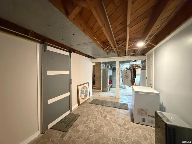 a view of a room with table and chairs
