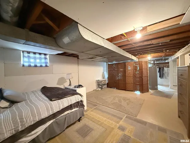 a spacious bedroom with a bed and a walk in closet