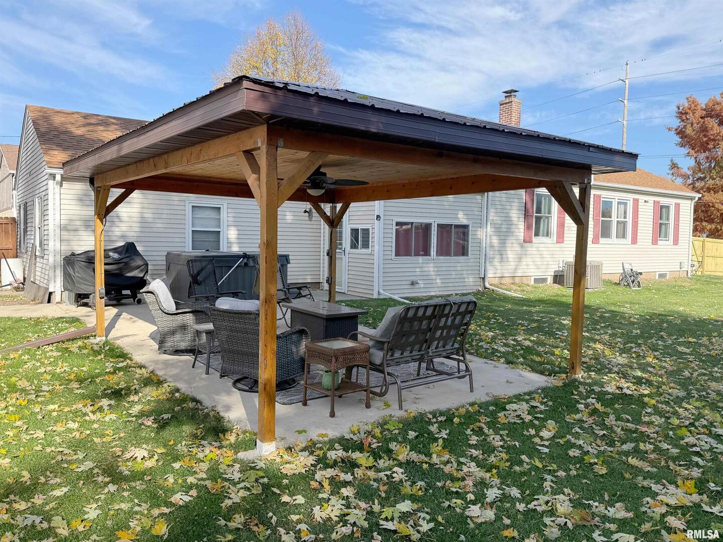 640 32nd Avenue Moline, IL 61265 - Photo 31 of 37 a view of a chair and table in backyard of the house