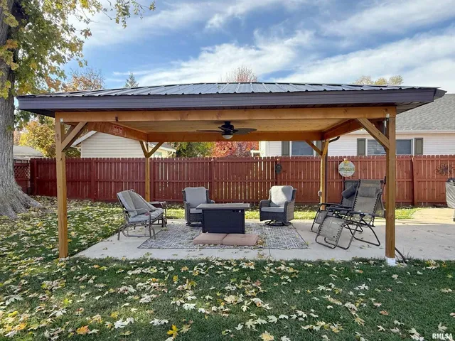 a view of patio with chairs and a table