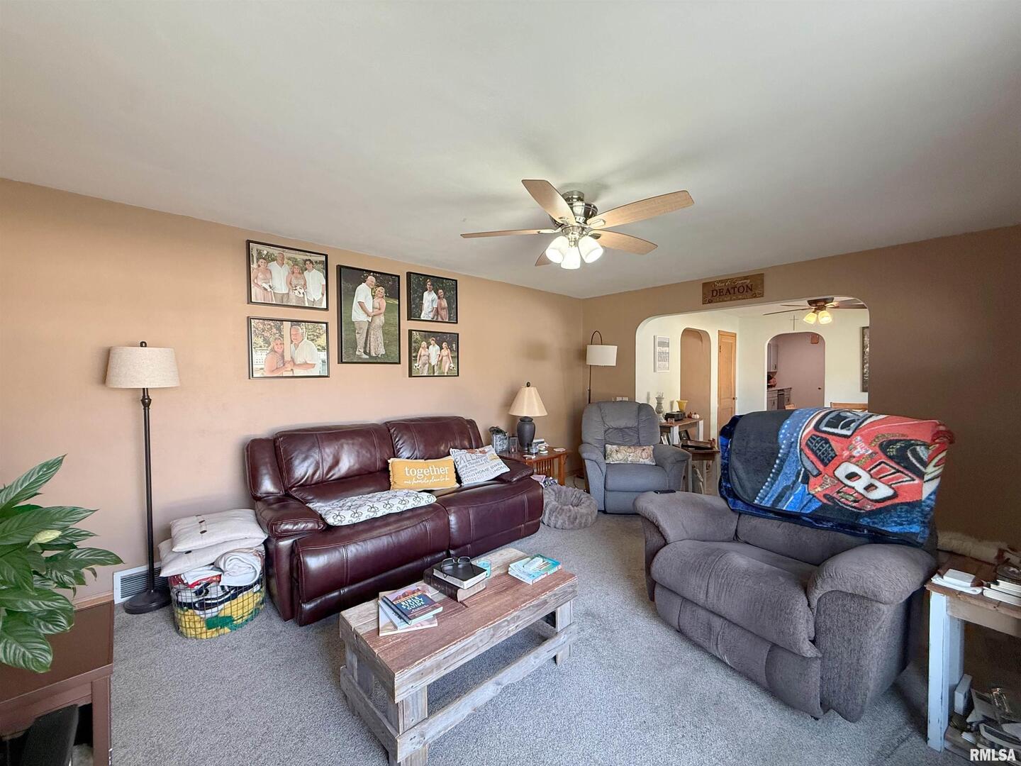 640 32nd Avenue Moline, IL 61265 - Photo 8 of 37 a living room with furniture a rug and a window