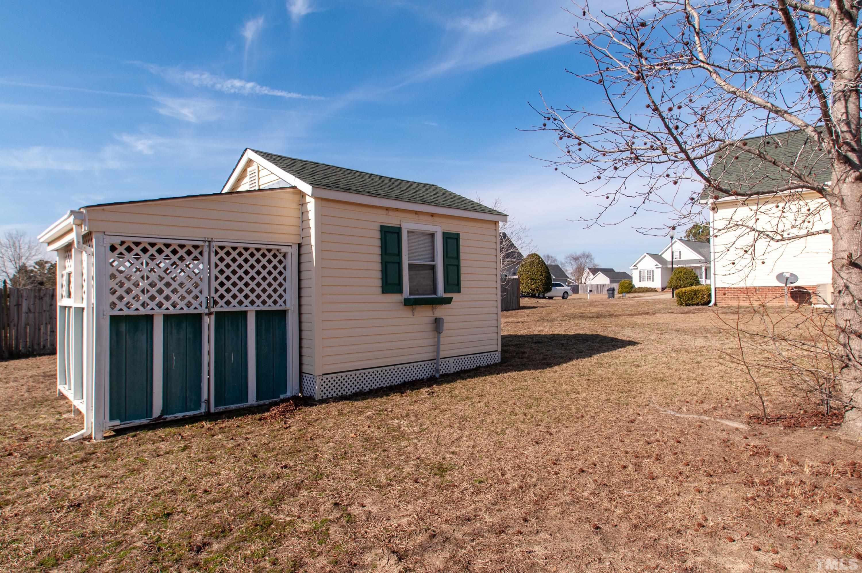 5012 Contender Drive Raleigh, NC 27603 - Photo 24 of 27 a front view of a house with a yard