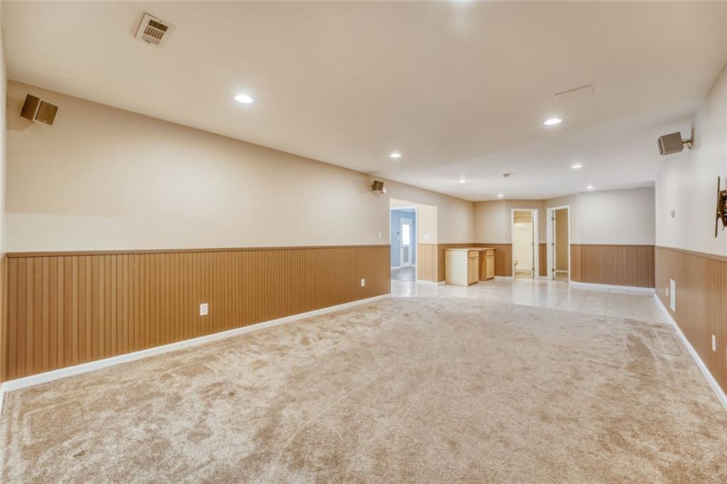 2531 Apalachee Run Way Dacula, GA 30019 - Photo 13 of 29 a view of empty room with kitchen
