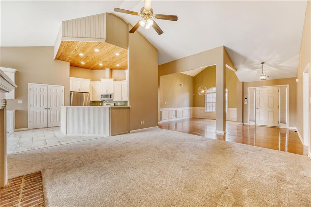 2531 Apalachee Run Way Dacula, GA 30019 - Photo 6 of 29 a view of a kitchen with a sink and refrigerator