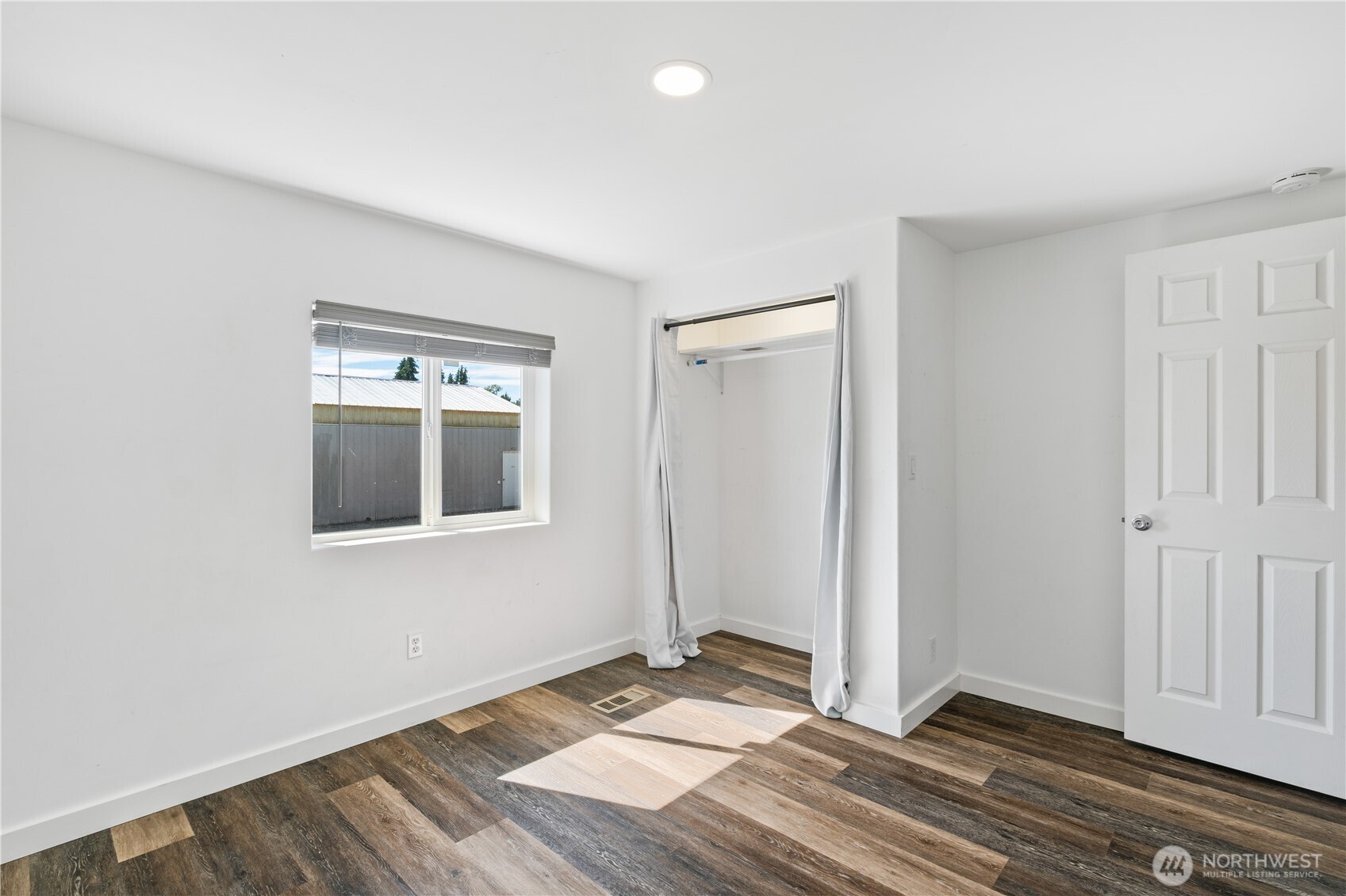 3471 Birch Bay Lynden Road Custer, WA 98240 - Photo 19 of 38 an empty room with wooden floor and windows