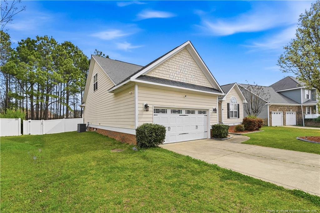 212 Lennox Loop Raeford, NC 28376 - Photo 40 of 47 a view of a house with a yard and a yard