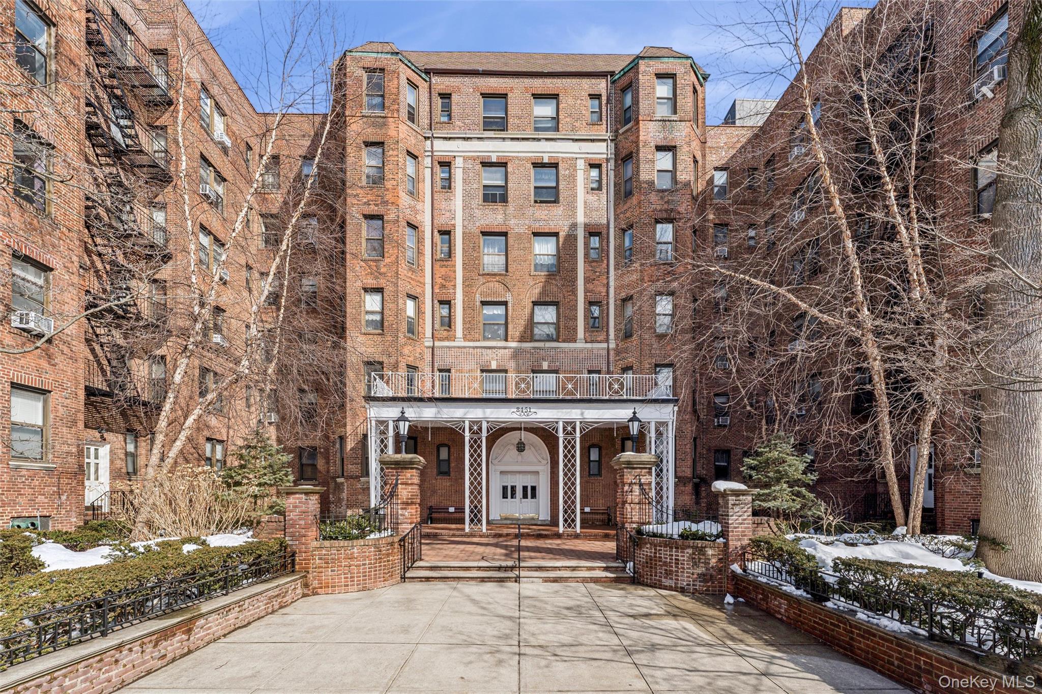 a front view of a building with large windows