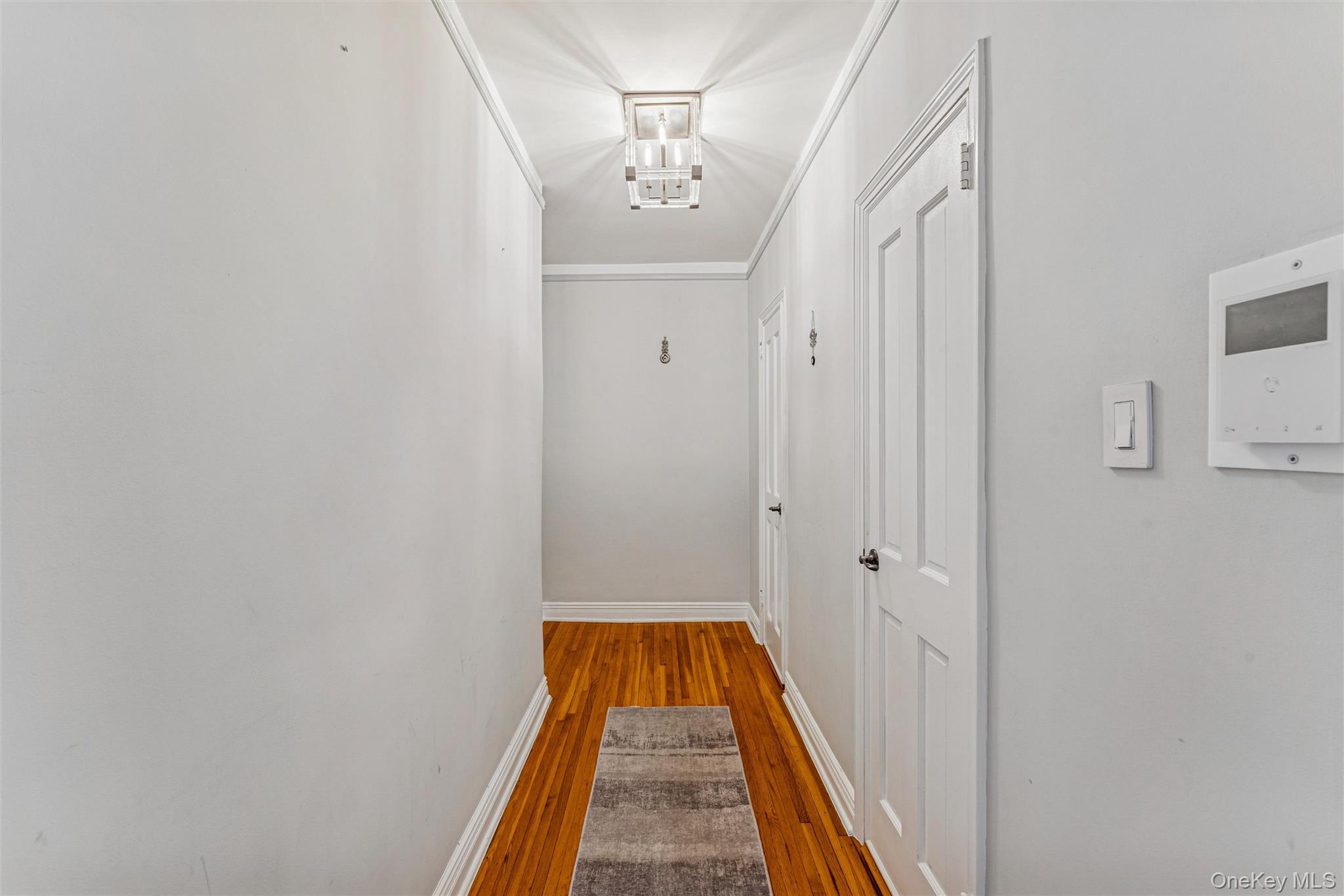 84-51 Beverly Road, Unit 6R Queens, NY 11415 - Photo 13 of 19 a view of a hallway with a entryway