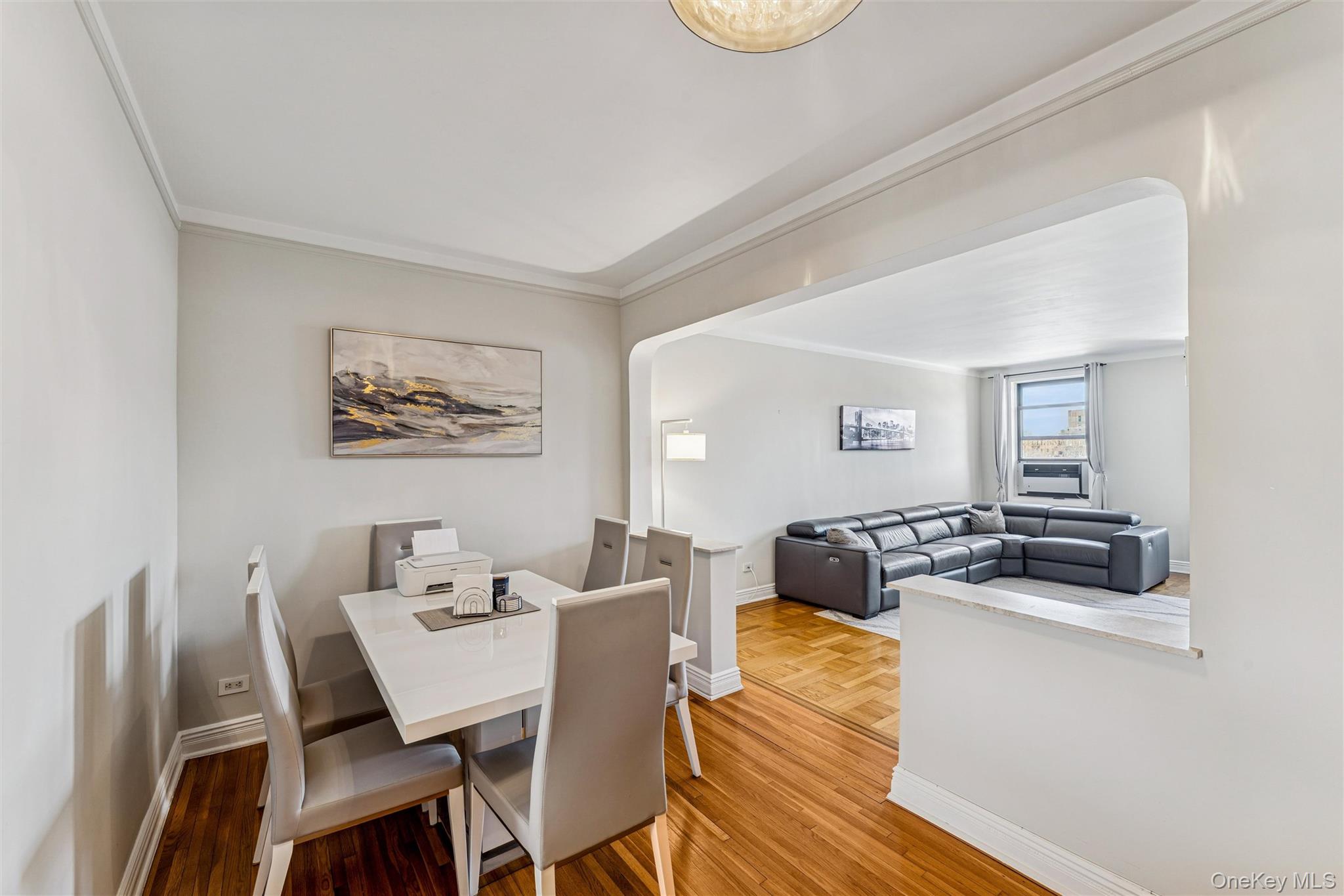 84-51 Beverly Road, Unit 6R Queens, NY 11415 - Photo 6 of 19 a dining room with furniture and a wooden floor