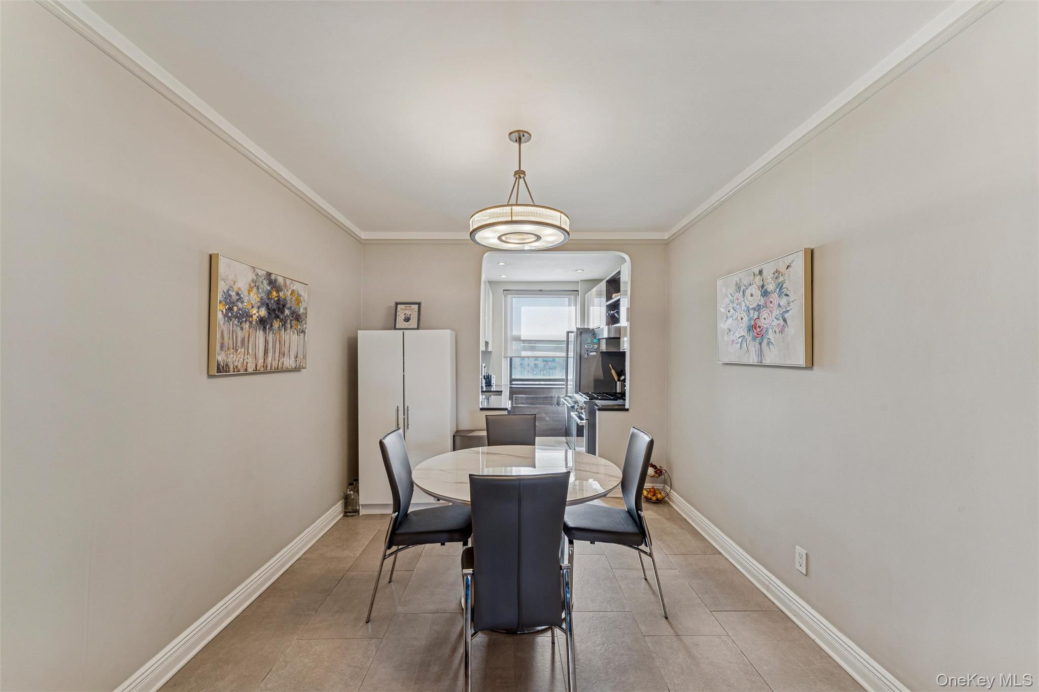 84-51 Beverly Road, Unit 6R Queens, NY 11415 - Photo 7 of 19 a dining room with furniture and window