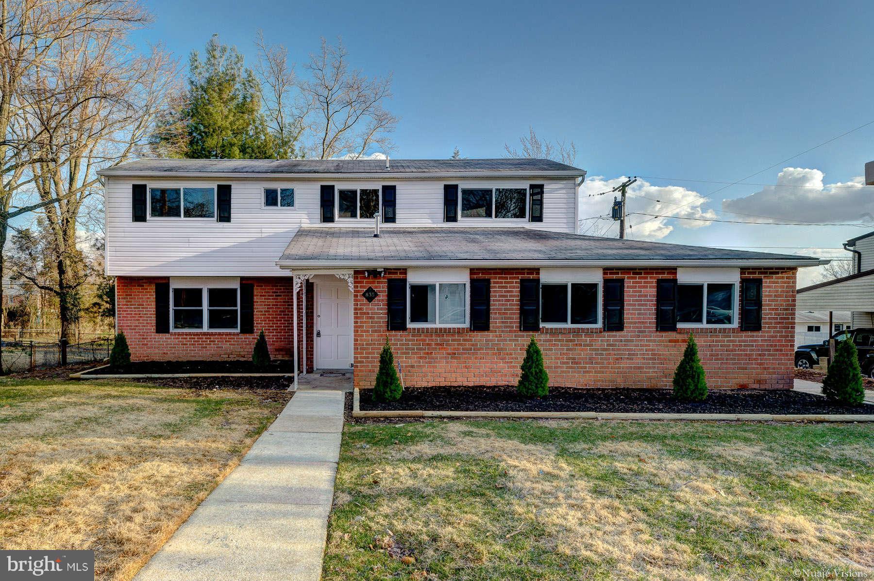 835 Milford Mill Road Baltimore, MD 21208 - Photo 3 of 30 a front view of a house with a yard