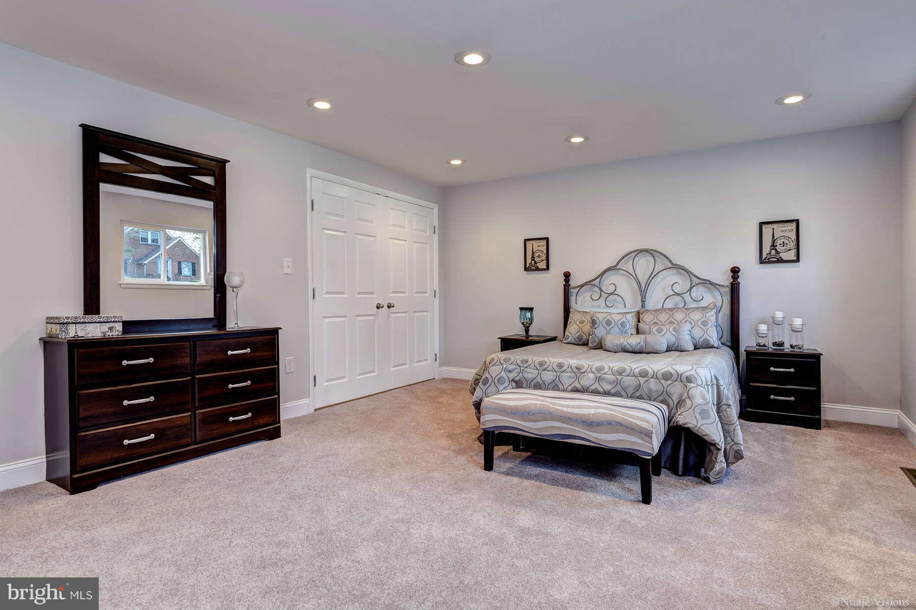 835 Milford Mill Road Baltimore, MD 21208 - Photo 22 of 30 a bedroom with a bed and a dresser