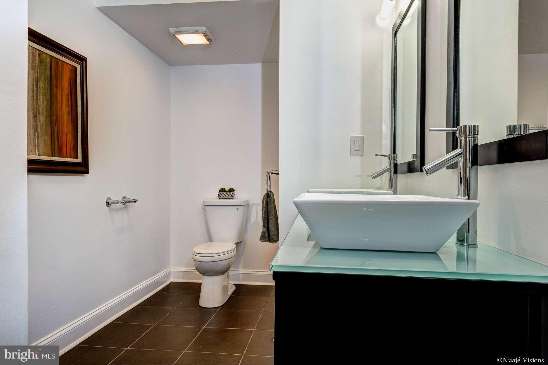 835 Milford Mill Road Baltimore, MD 21208 - Photo 23 of 30 a bathroom with a sink and a mirror