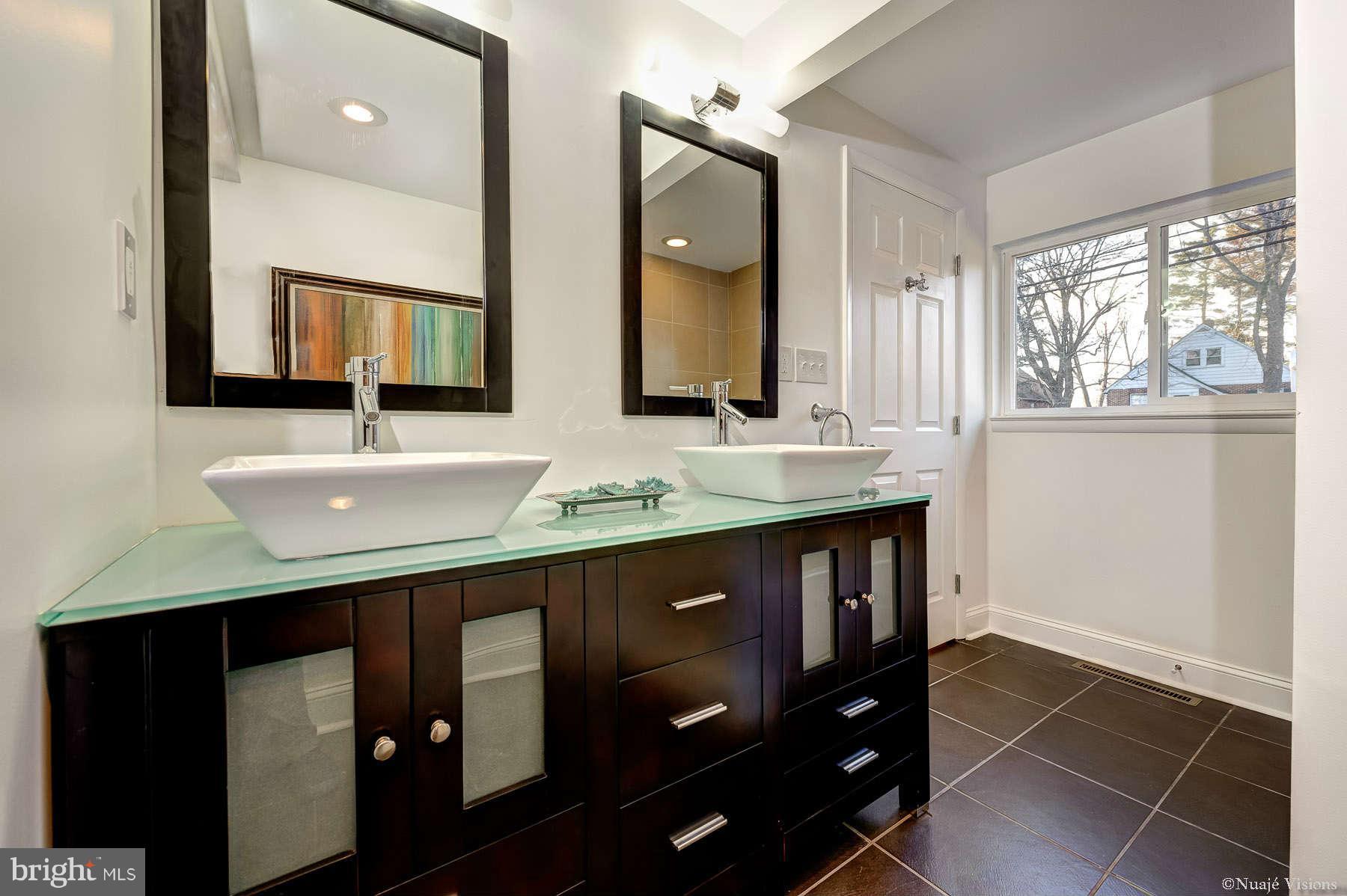 835 Milford Mill Road Baltimore, MD 21208 - Photo 24 of 30 a bathroom with a sink vanity and a mirror