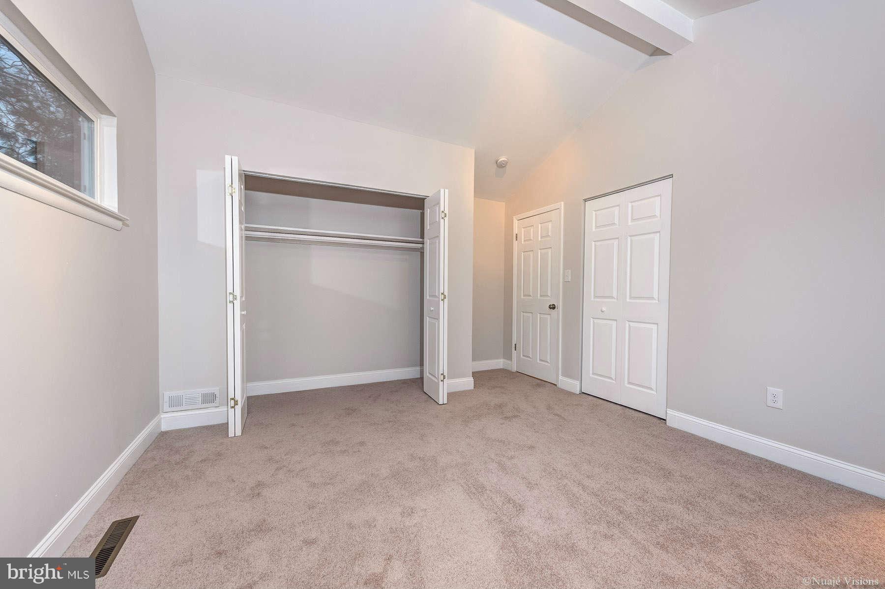 835 Milford Mill Road Baltimore, MD 21208 - Photo 27 of 30 an empty room with closet area