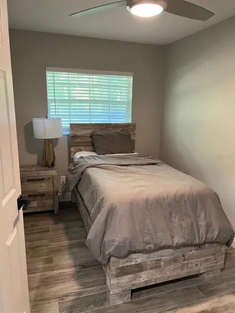 a view of a field with trees in the background