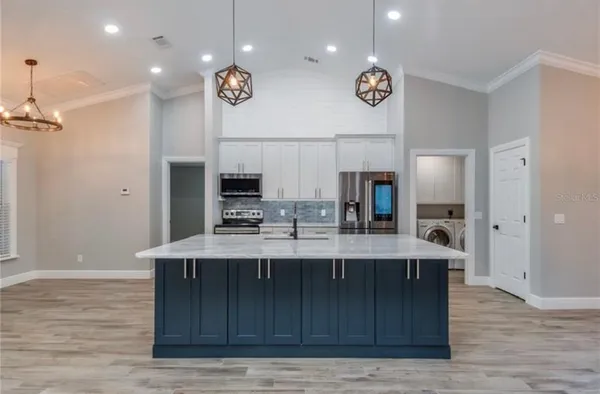 a bathroom with double sink and a mirror